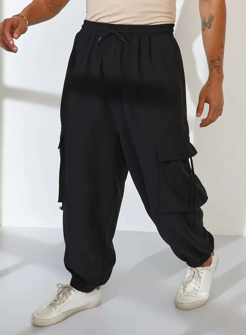 CAHOOT  Men's Charcoal Black Cuffed Baggy Utility Trousers For Casual Wear | Mid-Rise | 4 Pockets | Drawstring Closure | Cargo Pants Crafted With Comfort Fit For Everyday Wear for Men | Best Price UAE